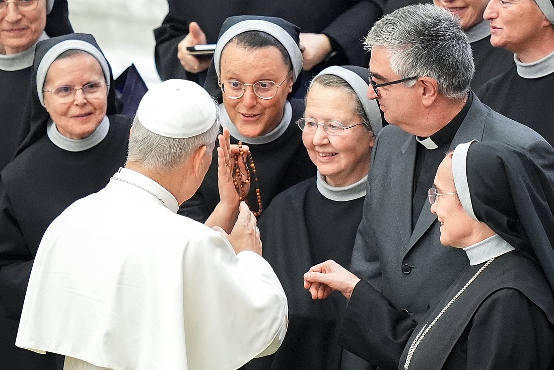 Pope Leo XIV greets a group of religious sisters and priests in the Paul VI Audience Hall at the conclusion of his weekly general audience at the Vatican Aug. 20, 2025. (CNS photo/Lola Gomez)