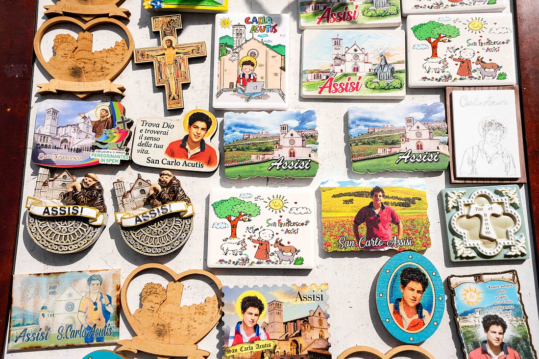 Souvenirs depicting Carlo Acutis as a saint are displayed for sale in Assisi, Italy, Aug. 21, 2025, ahead of his canonization by Pope Leo XIV at the Vatican Sept. 7. Acutis, who died in 2006 at age 15, will be the first millennial saint. (CNS photo/Lola Gomez)