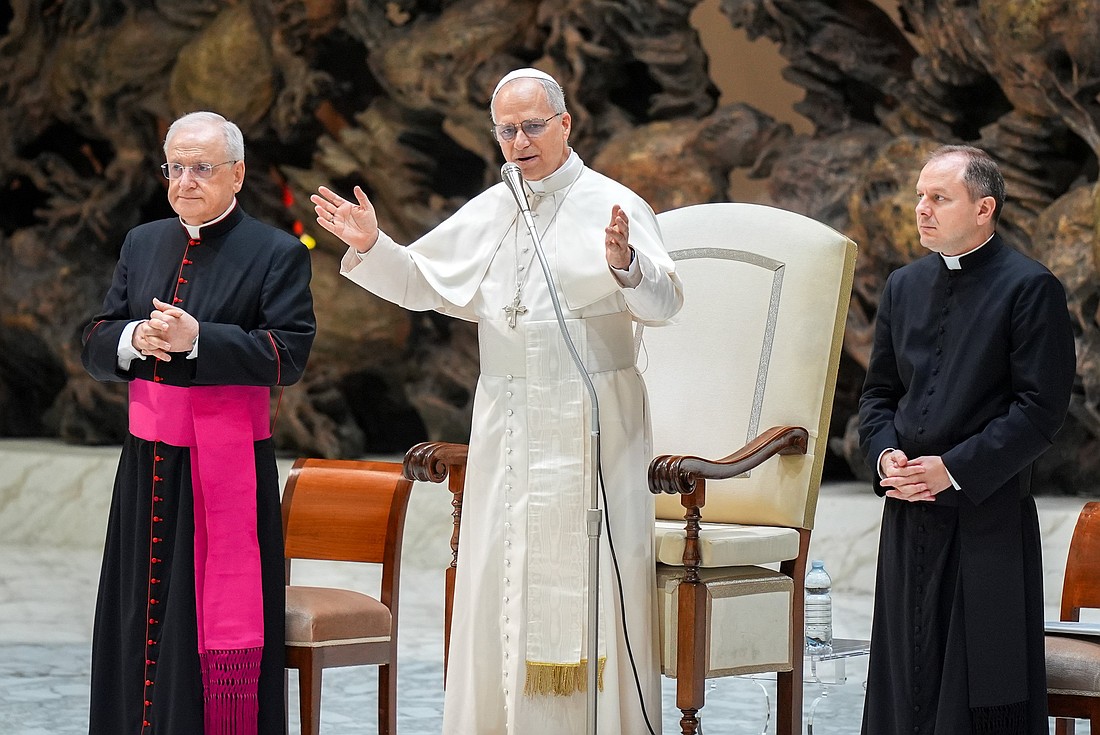Pope Leo XIV greets visitors and pilgrims as he arrives in the Paul VI Audience Hall at the Vatican for his weekly general audience Aug. 27, 2025. (CNS photo/Lola Gomez)