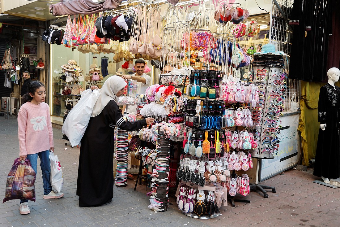 Woman and girl shop in the Nablus market in the Israeli-occupied West Bank, March 15, 2025, as the region's market and economy are facing difficulties due to Israeli military restrictions, adding more checkpoints and roadblocks that have severely limited the movement of Palestinians. (OSV News photo/Raneen Sawafta, Reuters)