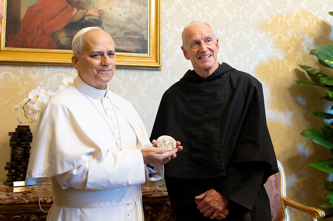 Pope Leo XIV holds the St. Augustine Medal, which was presented to him by Augustinian Father Robert P. Hagan, prior of the order's U.S. Province of St. Thomas of Villanova, during a meeting July 18, 2025, at Villa Barberini in Castel Gandolfo, Italy. The pope recorded a video message of thanks, which was played in Philadelphia Aug. 28, 2025. (CNS photo/Vatican Media)