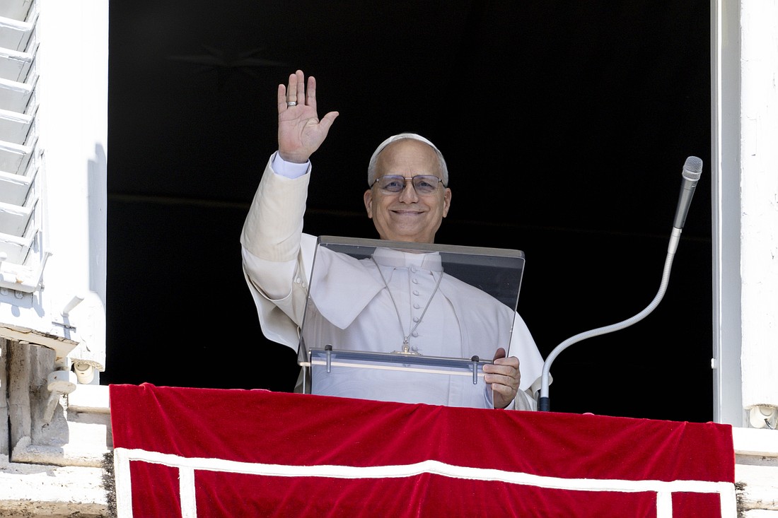 Pope Leo XIV waves to visitors and pilgrims in St. Peter's Square at the Vatican Aug. 31, 2025, before leading the recitation of the Angelus prayer. (CNS photo/Vatican Media)
