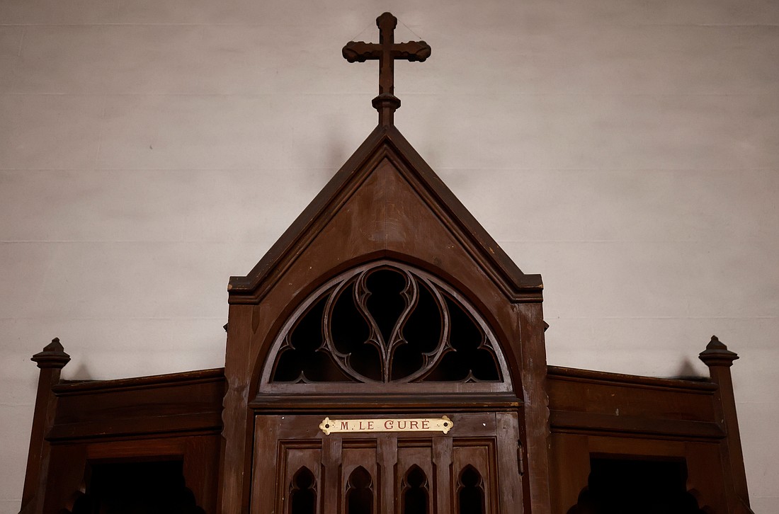 A confessional on which is written: "M. the Priest" is pictured in a Catholic church near Nantes, France, Oct. 5, 2021. (CNS photo/Stephane Mahe, Reuters)