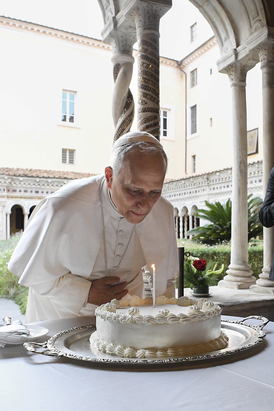 Pope Leo XIV blows out a candle on a cake for his 70th birthday Sept. 14, 2025, as cardinals, Vatican officials and ecumenical leaders look on after a prayer service at Rome's Basilica of St. Paul Outside the Walls. (CNS photo/Vatican Media)