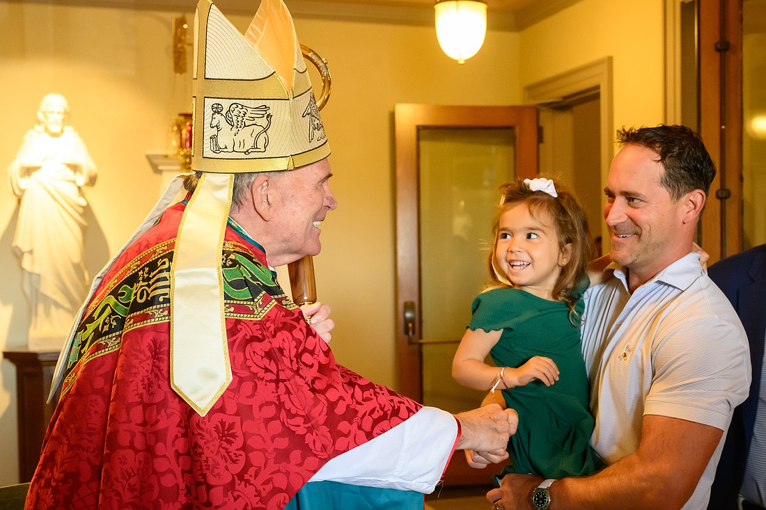 Bishop O'Connell greets Holy Cross, Rumson, parishioners, following the Mass he celebrated Sept. 14. Mike Ehrmann photo