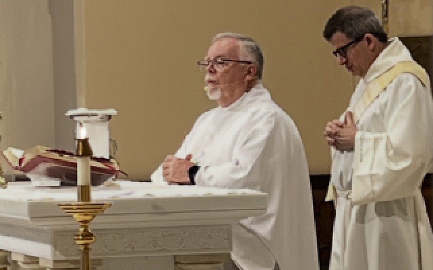 Father Jim Grogan, pastor of Our Lady of Good Counsel Parish, celebrates Mass during the Holy Innocents Society gathering. He is assisted by Deacon Stuart Altschuler. Courtesy photo