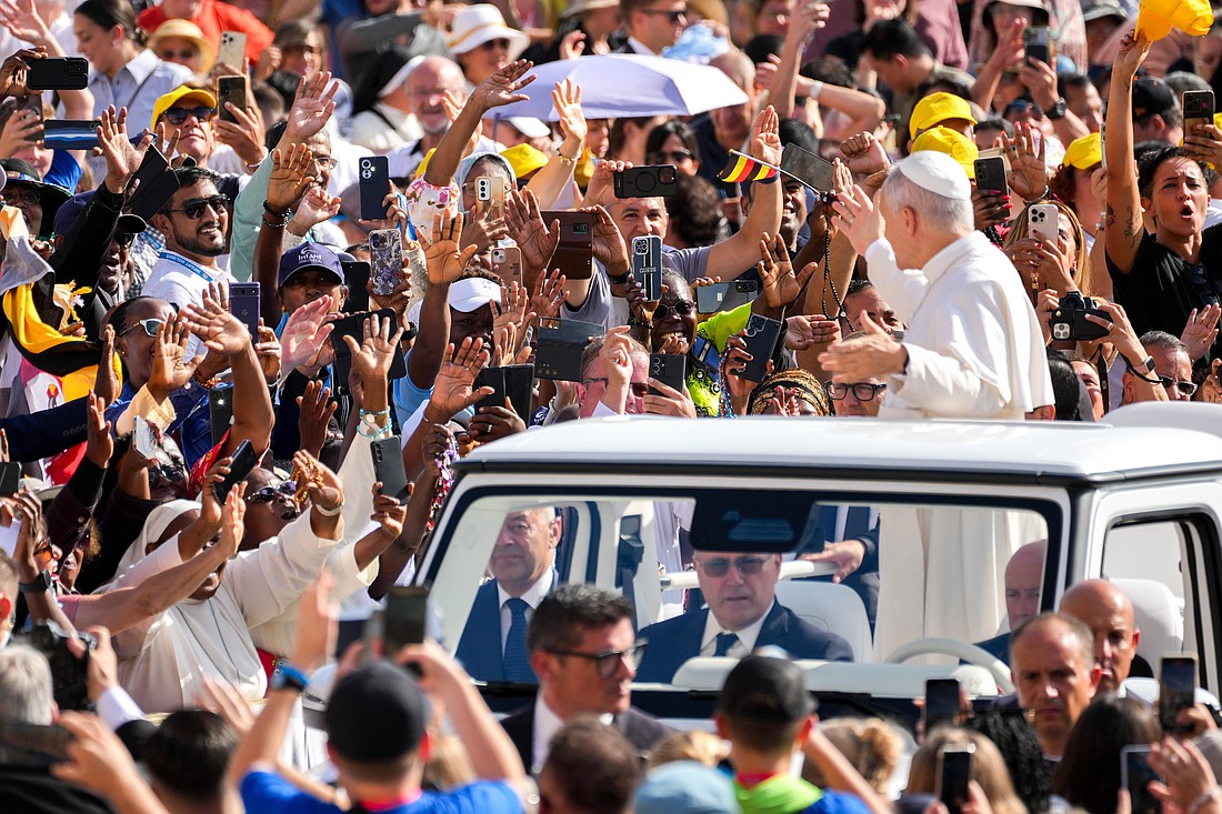 People greet Pope Leo XIV as he rides in the popemobile around St. Peter’s Square at the Vatican before his weekly general audience Sept. 17, 2025. (CNS photo/Lola Gomez)
