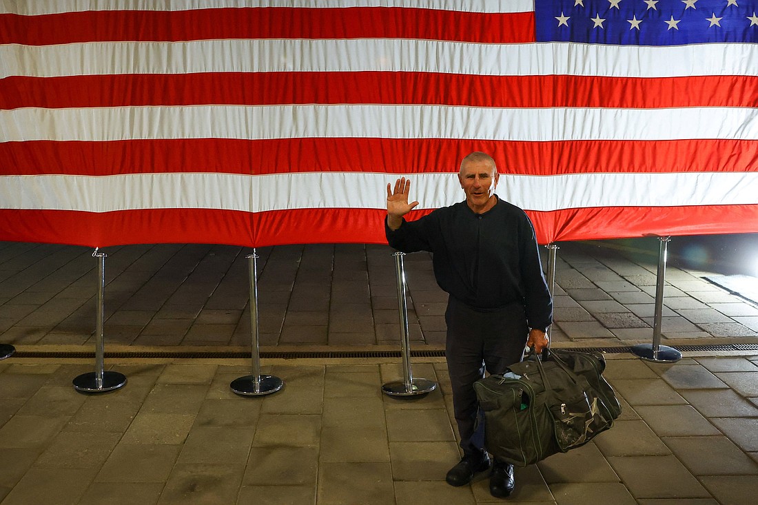 Andrei Krylov, a political prisoner released from a five-year term for "organizing mass riots" in Belarus, waves as he arrives at the U.S. Embassy in Vilnius, Lithuania, Sept. 11, 2025. (OSV News photo/Kacper Pempel, Reuters)
