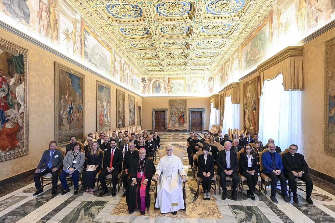 Pope Leo XIV poses for a photo with participants in a reflection on "the future of life and the family" in Latin America during an audience at the Vatican Sept. 19, 2025. Seated next to the pope is Auxiliary Bishop Lizardo Estrada Herrera of Cusco, Peru, secretary-general of CELAM, the Latin American bishops' council. (CNS photo/Vatican Media)