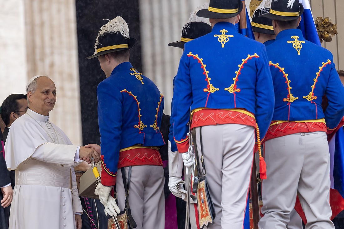 Pope Leo XIV greets members of the honor guard of Slovakia's presidential palace at the end of his weekly general audience in St. Peter's Square at the Vatican Sept. 24, 2025. (CNS photo/Pablo Esparza)