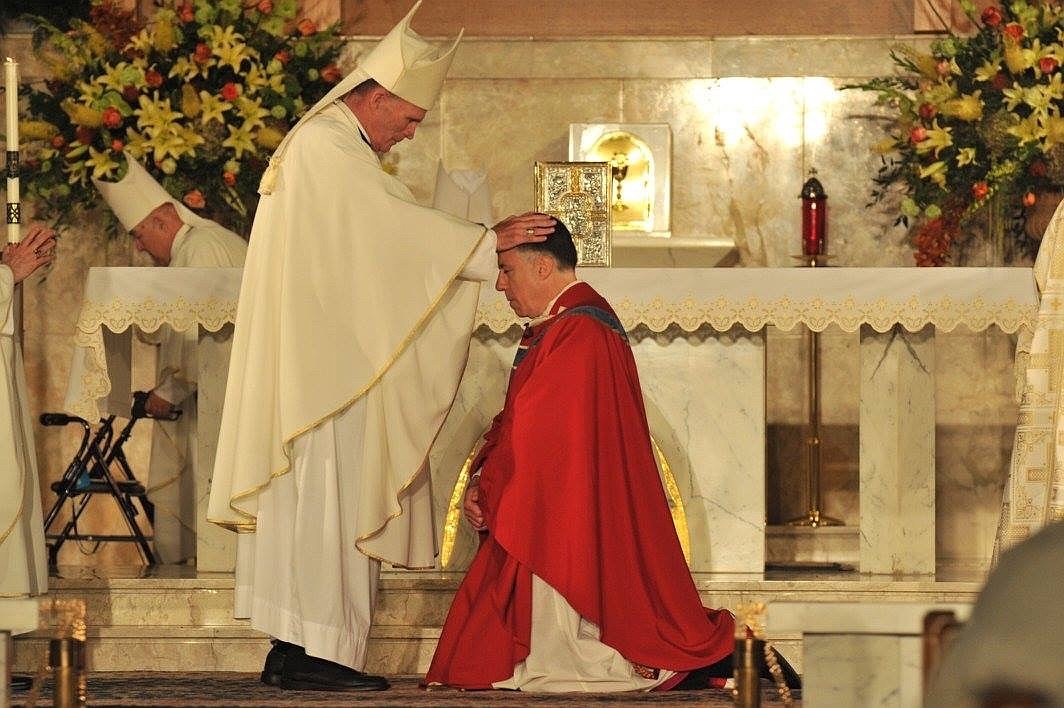 Bishop O'Connell laying hands on Bishop Checchio at his 2016 ordination as Bishop of Metuchen.