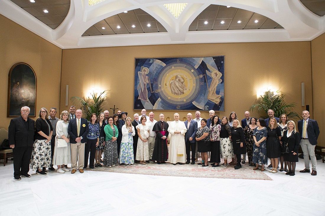 Pope Leo XIV poses for a photo with Archbishop Charles C. Thompson of Indianapolis, chair of the U.S. bishops' Committee for Evangelization and Catechesis, and members of a pilgrimage for the Jubilee of Catechists at the Vatican Sept. 27, 2025. (CNS photo/Vatican Media)