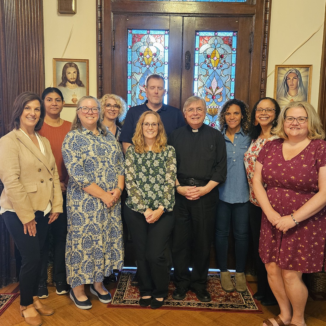 A group of catechists from Sacred Heart Parish, Mount Holly, join Denise Contino, director of the diocesan Department of Catechesis, their pastor, Father John Czahur, and parish catechetical leader, Barbara Kane, for a Catechetical Sunday celebration on Sept. 21. Mary Stadnyk photo