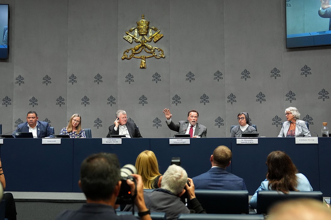 Arnold Schwarzenegger, actor and former California governor, gestures during a Vatican news conference on “Raising Hope for Climate Justice” Sept. 30, 2025. He is joined on the panel by Brazilian Cardinal Jaime Spengler of Porto Alegre, Salesian Sister Alessandra Smerilli, secretary of the Dicastery for Promoting Integral Human Development, and others. (CNS photo/Lola Gomez)