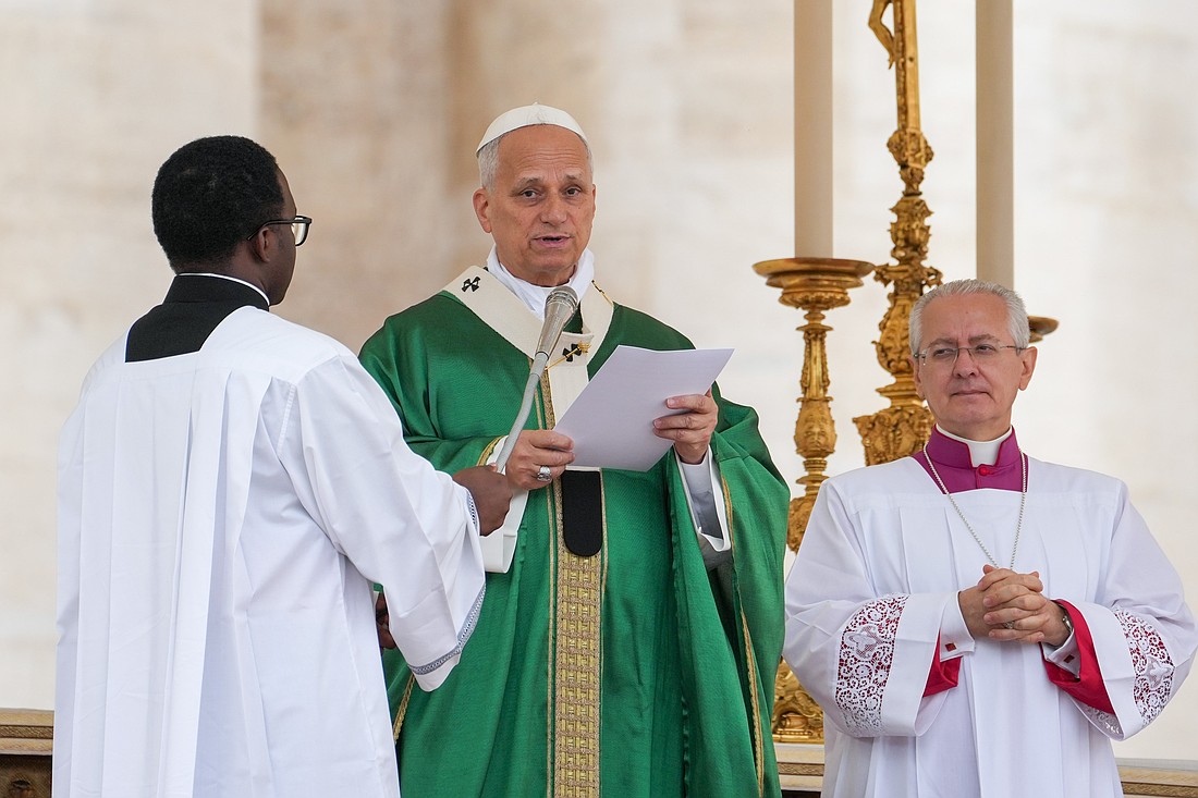 Pope Leo XIV speaks to visitors and pilgrims as he recites the Angelus after celebrating Mass for the Jubilee of Migrants and the Jubilee of the Missions in St. Peter’s Square at the Vatican Oct. 5, 2025. (CNS photo/Lola Gomez)