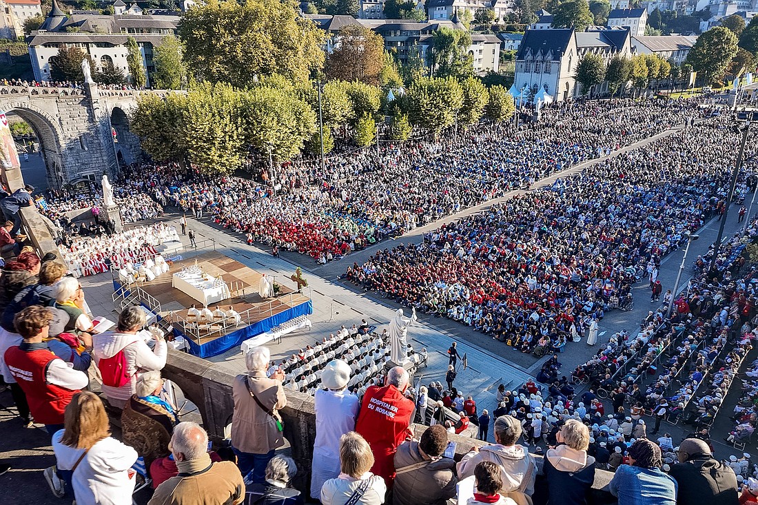 Crowds of pilgrims pray in front of the Basilica of the Rosary in Lourdes, France, during the Oct. 2-4, 2025, the "Rosary Pilgrimage," organized by the Dominican order since 1908. The Marian shrine of Lourdes welcomed a record number of participants this year -- 17,000 pilgrims were present, 2,000 more than in 2024. (OSV News photo/courtesy Lourdes shrine)
