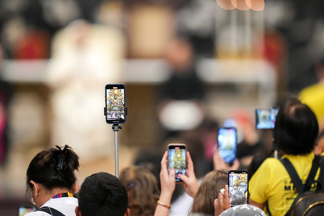 Participants use their cellphones to record Pope Leo XIV as he addresses them during the Jubilee of Digital Missionaries and Catholic Influencers after Cardinal Luis Antonio Tagle celebrated Mass in St. Peter’s Basilica at the Vatican July 29, 2025. (CNS photo/Lola Gomez)