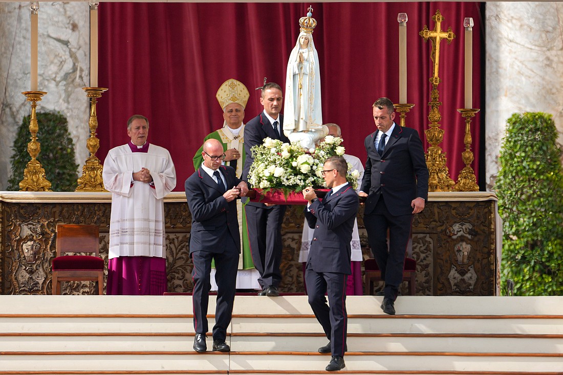 Pope Leo XIV looks on as the original statue of Our Lady of Fatima is carried away at the end of Mass in St. Peter’s Square at the Vatican Oct. 12, 2025, celebrated as part of the Jubilee of Marian Spirituality. (CNS photo/Lola Gomez)