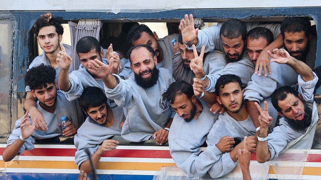 Freed Palestinian prisoners released by Israel as part of a hostages-prisoners swap and a ceasefire deal between Hamas and Israel, gesture, in Khan Younis in the southern Gaza Strip, Oct.13, 2025. (OSV News photo/Ramadan Abed, Reuters)