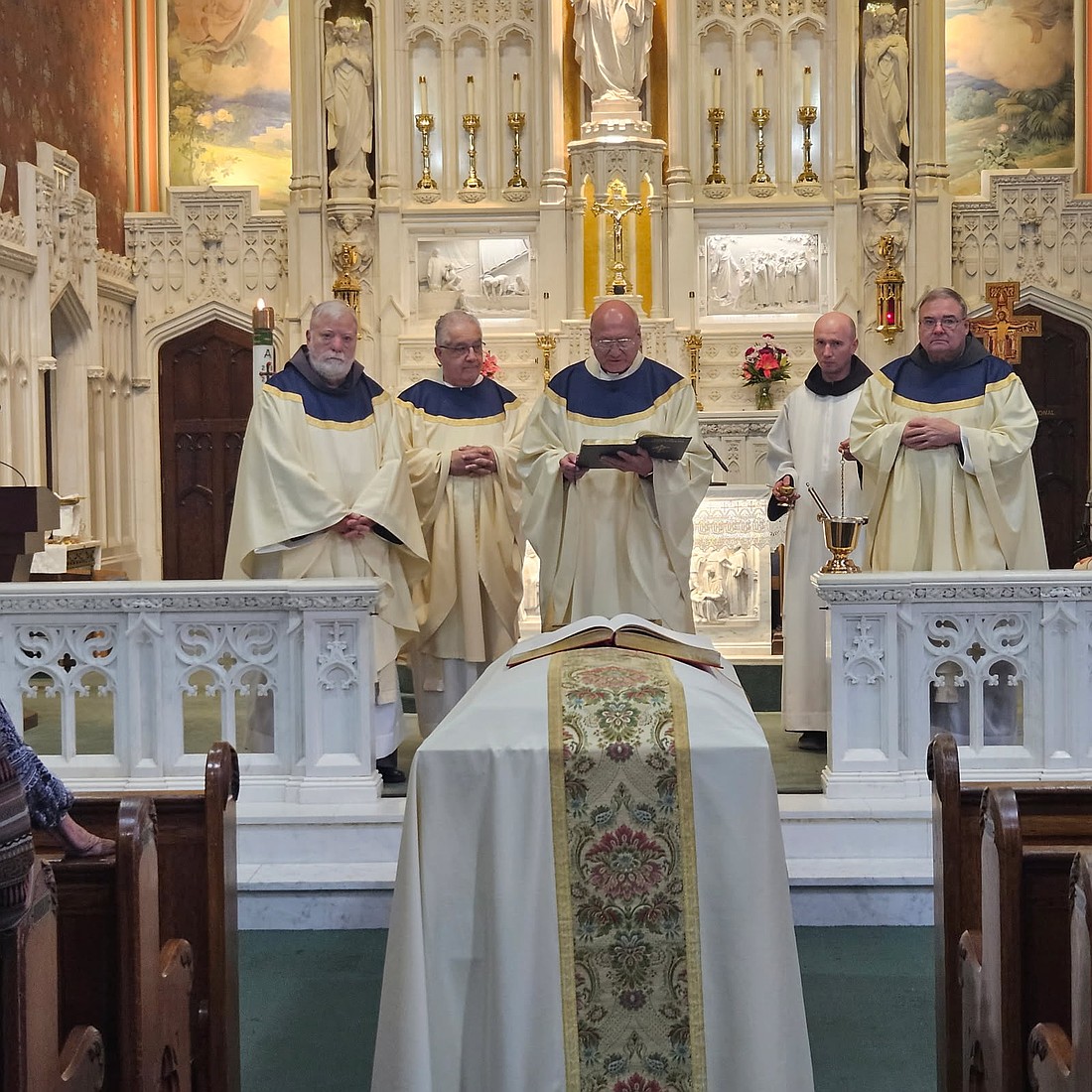 At the end of the Funeral Mass, Msgr. Edward Arnister, center, leads the Final Commendation for his cousin, Father Varga. Mary Stadnyk photos