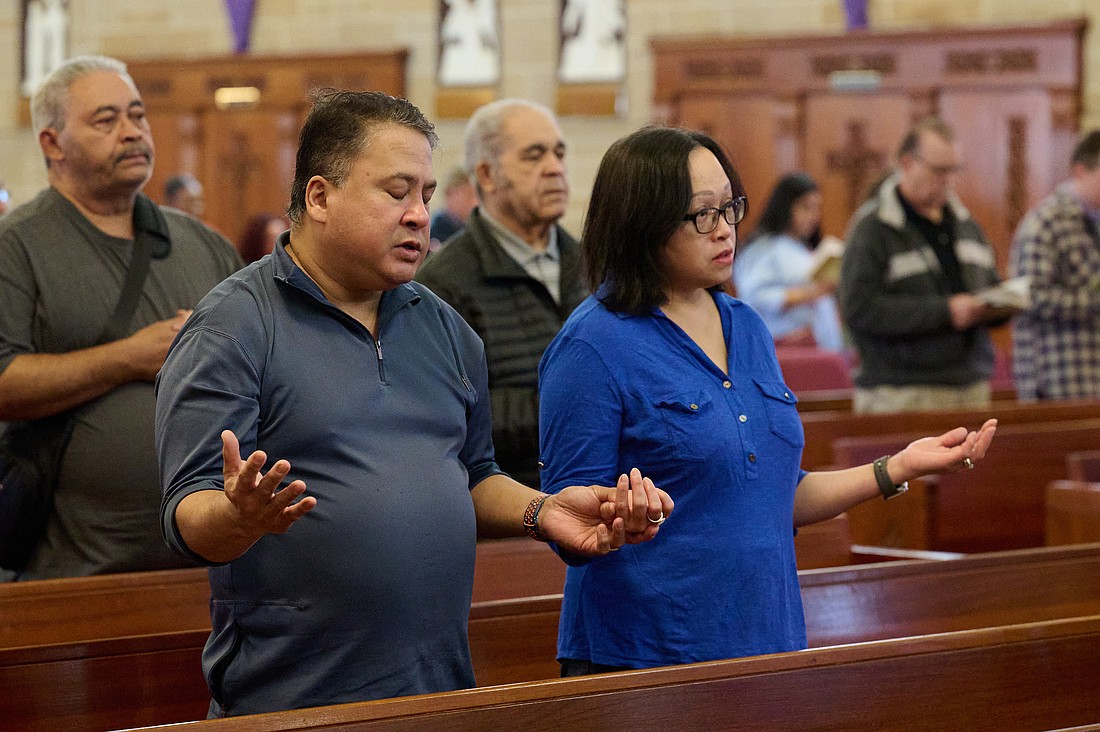 Parishioners pray during the Commemoration of the Lord’s Passion on Good Friday 2025 in St. Mary of the Assumption Cathedral, Trenton. In his column, Father Neiser Cardenas reflects on how Hispanic Heritage Month is a time to note the significant contributions made by members of the Latino community in the United States. Mike Ehrmann photo