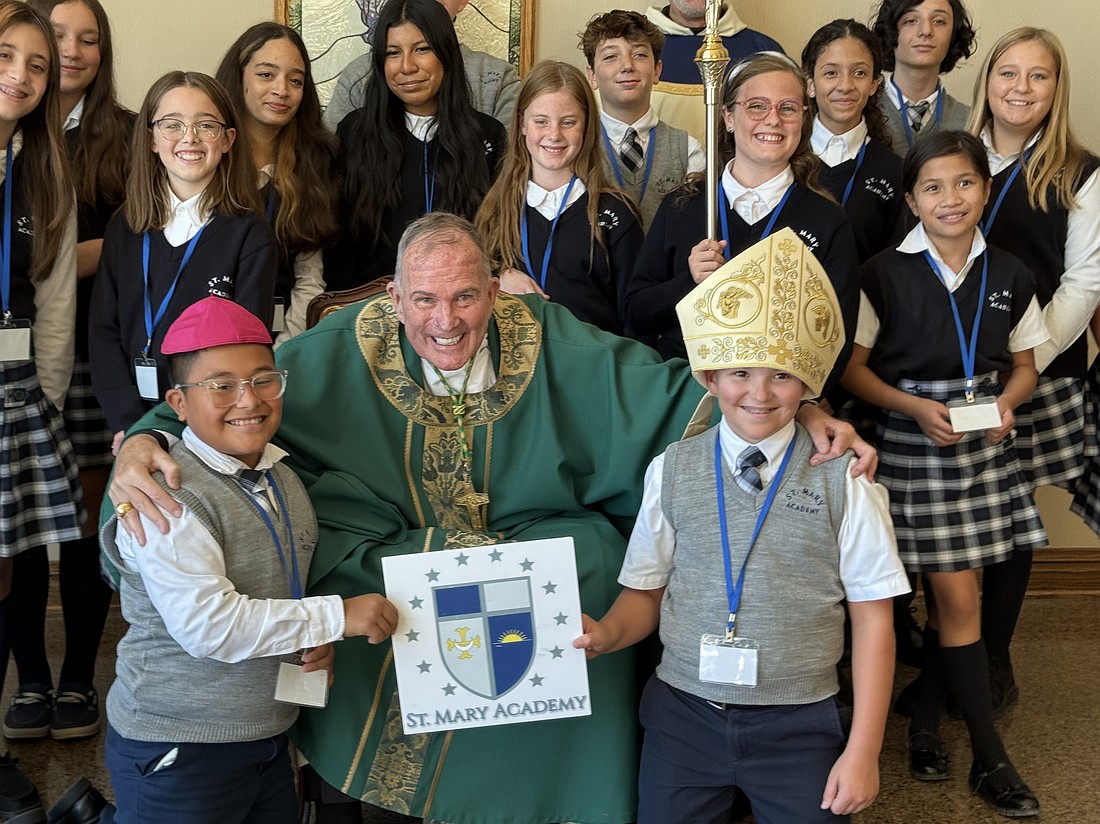 During their group photo with Bishop O'Connell, two students from St. Mary Academy, Manahawkin, got a chance to see what it's like to be a bishop. The student on the left is wearing Bishop O'Connell's zucchetto (skullcap) while the student on the right is wearing the Bishop's mitre. Rose O'Connor photo