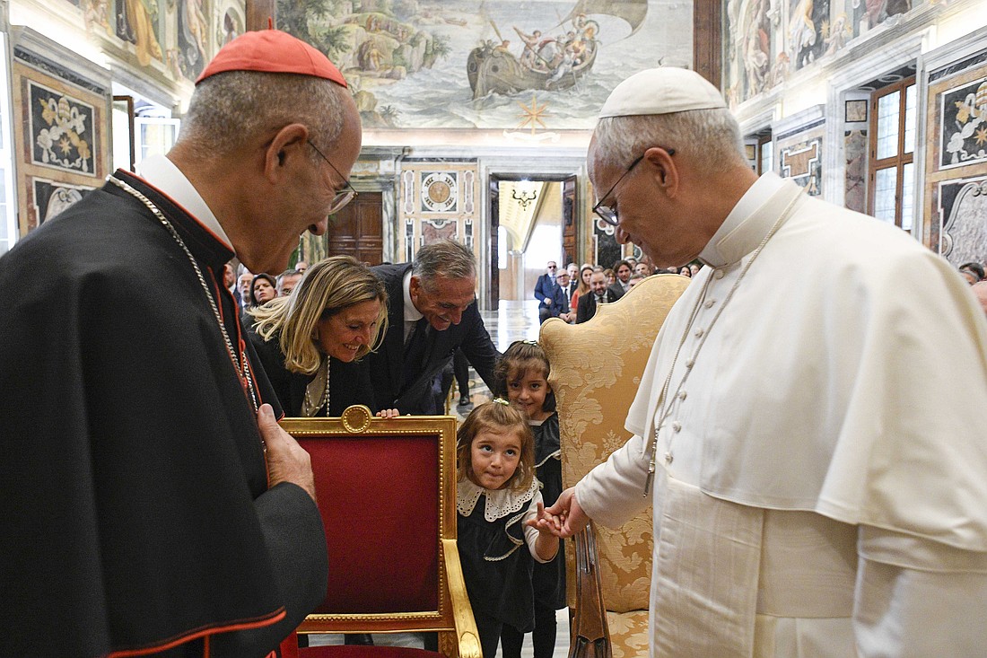 Pope Leo XIV greets children of participants in a seminar sponsored by the Pontifical Academy of Theology during an audience in the Apostolic Palace at the Vatican Sept. 13, 2025. Cardinal José Tolentino de Mendonça, prefect of the Dicastery for Culture and Education, looks on. (CNS photo/Vatican Media)