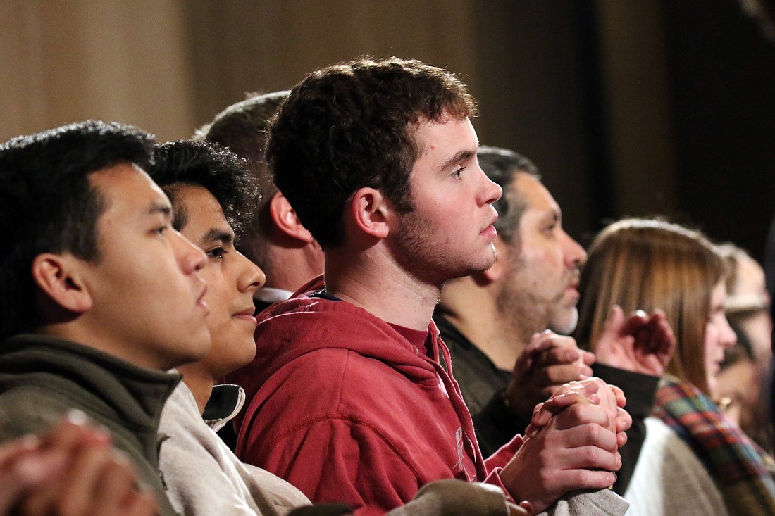Young people are pictured in a file photo hold inghands as they pray the Lord's Prayer during the opening Mass of the National Prayer Vigil for Life at the Basilica of the National Shrine of the Immaculate Conception in Washington. (OSV News photo/Gregory A. Shemitz)