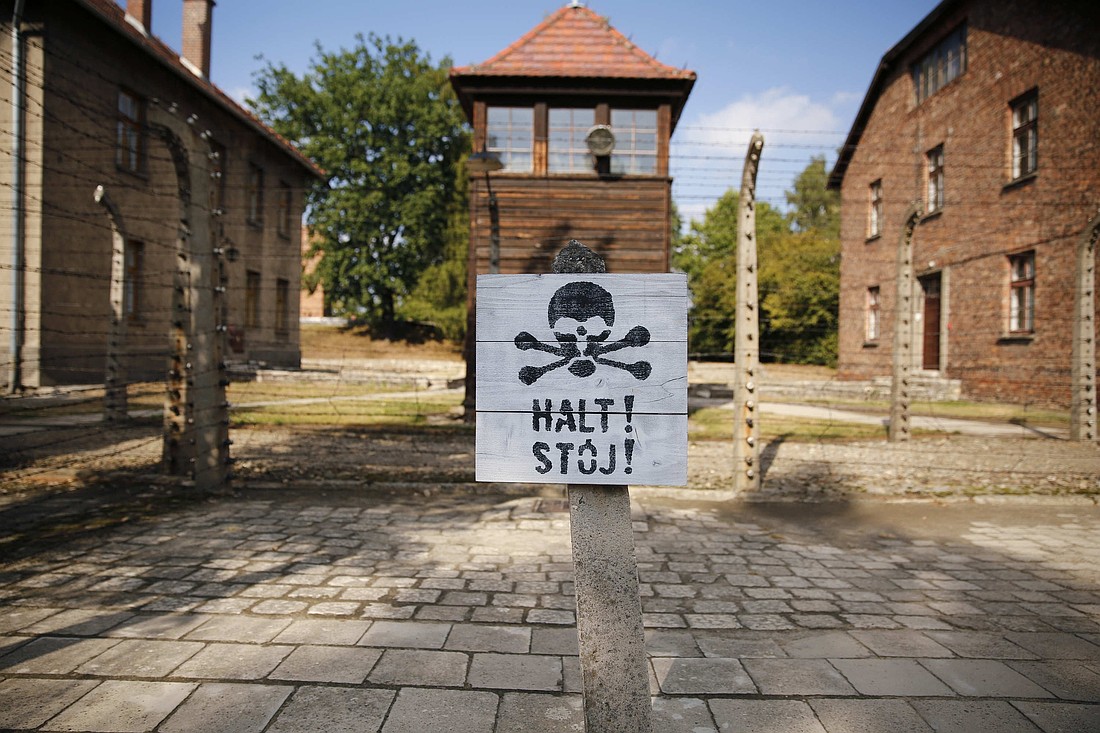 In this 2015 file photo, a guard tower is seen beyond an area enclosed with barbed wire at the Auschwitz-Birkenau Memorial and State Museum in Oswiecim, Poland. (CNS photo/Nancy Wiechec)