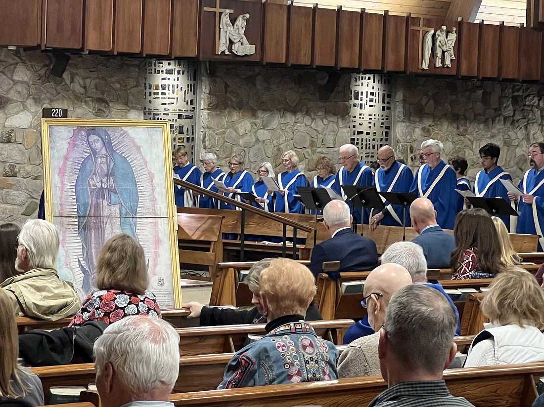 Choir members lead the congregation in song during the prayer service that had has its theme, “Mary, Full of Grace.” Elizabeth Zimak photos