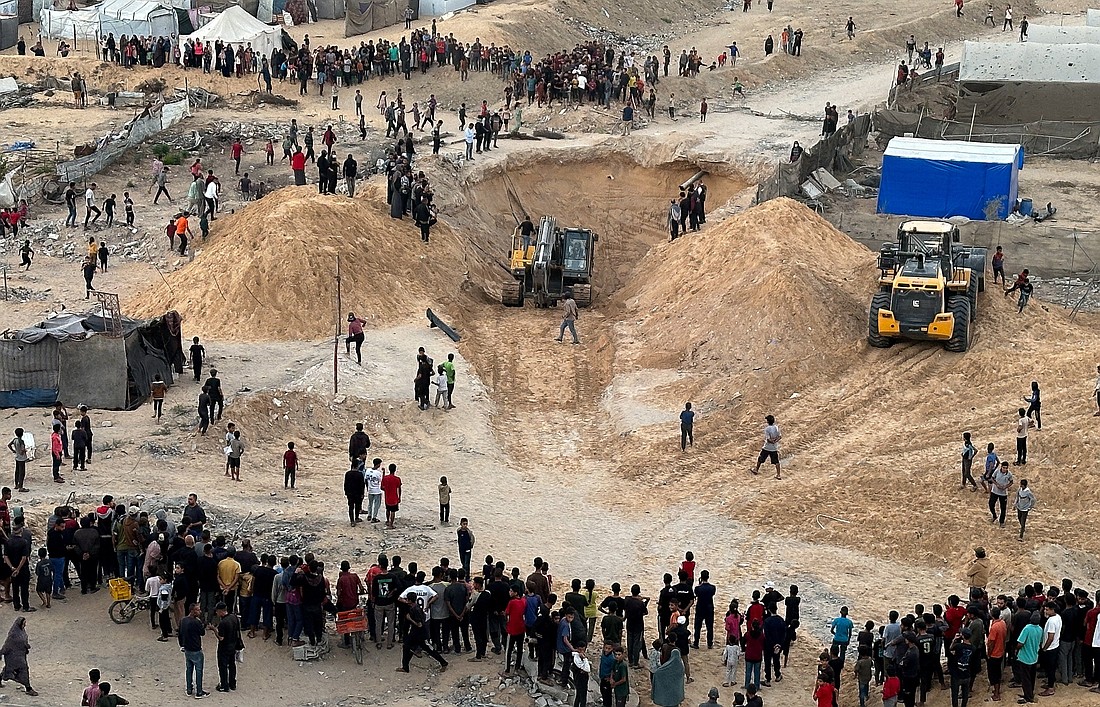 People gather Oct. 28, 2025, in Khan Younis in southern Gaza Strip during the search for the bodies of deceased hostages, kidnapped by Hamas during the Oct. 7, 2023, attack on Israel, amid a ceasefire between Israel and Hamas. (OSV News photo/Haseeb Alwazeer, Reuters)