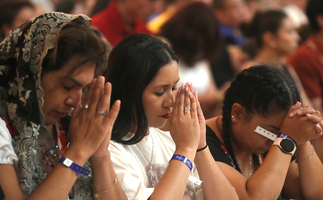 Women pray during a Mass for the feast of Corpus Christi at the Cathedral of Our Lady of the Angels in Los Angeles June 22, 2025, during the National Eucharistic Pilgrimage. (OSV News photo/Bob Roller)