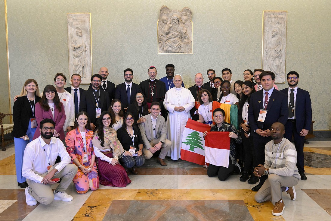 Pope Leo XIV poses for a photo with members of the International Youth Advisory Body and staff of the Dicastery for Laity, the Family and Life, which the young people advise, in the Apostolic Palace at the Vatican Oct. 31, 2025. (CNS photo/Vatican Media)