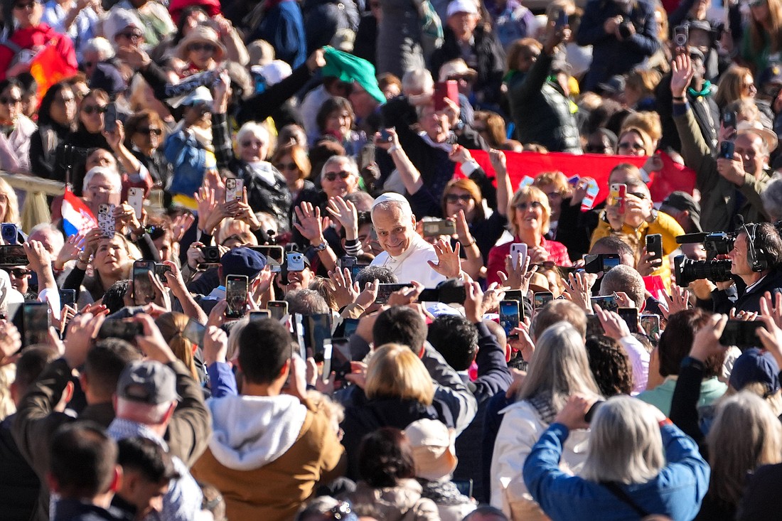 Pope Leo XIV greets visitors and pilgrims from the popemobile as he rides around St. Peter's Square at the Vatican before his weekly general audience Nov. 5, 2025. (CNS photo/Lola Gomez)