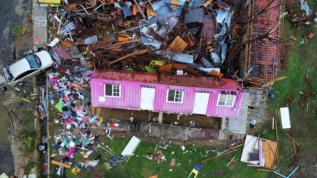 A drone view shows destroyed homes and a car in Belmont, Jamaica, Nov. 2, 2025, after Hurricane Melissa swept through the Caribbean nation. The catastrophic Category 5 storm that made landfall in Jamaica Oct. 28 has caused at least 75 deaths overall, up to $4 billion in insured losses in Jamaica and tens of billions of dollars of overall damage throughout the Caribbean, authorities in the storm-ravaged islands said Nov. 3. (OSV News photo/Raquel Cunha, Reuters)