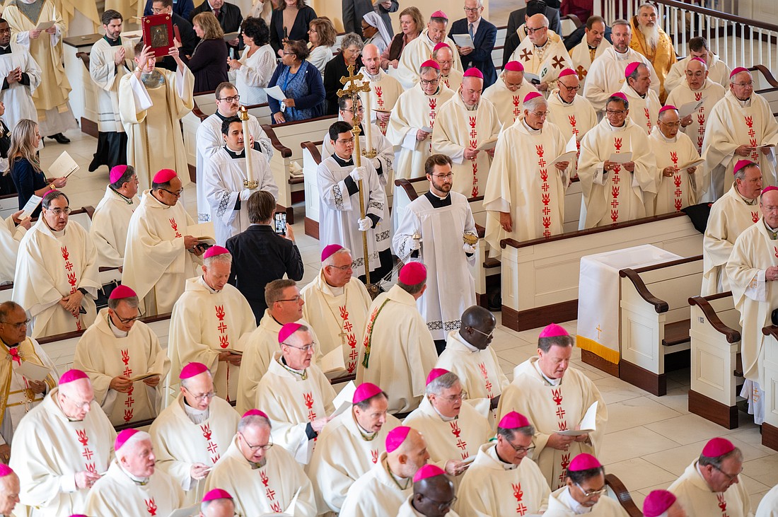 Bishops from around the country gather at the Basilica of the National Shrine of the Assumption of the Blessed Virgin Mary in Baltimore Nov. 10, 2025, for the opening Mass of the U.S. Conference of Catholic Bishops' fall plenary assembly. At left Bishop David M. O'Connell, C.M., and diocesan priests Father Christopher Dayton and Father Jean Felicien are seen participating in the Mass. (OSV News photo/Kevin J. Parks, Catholic Review)