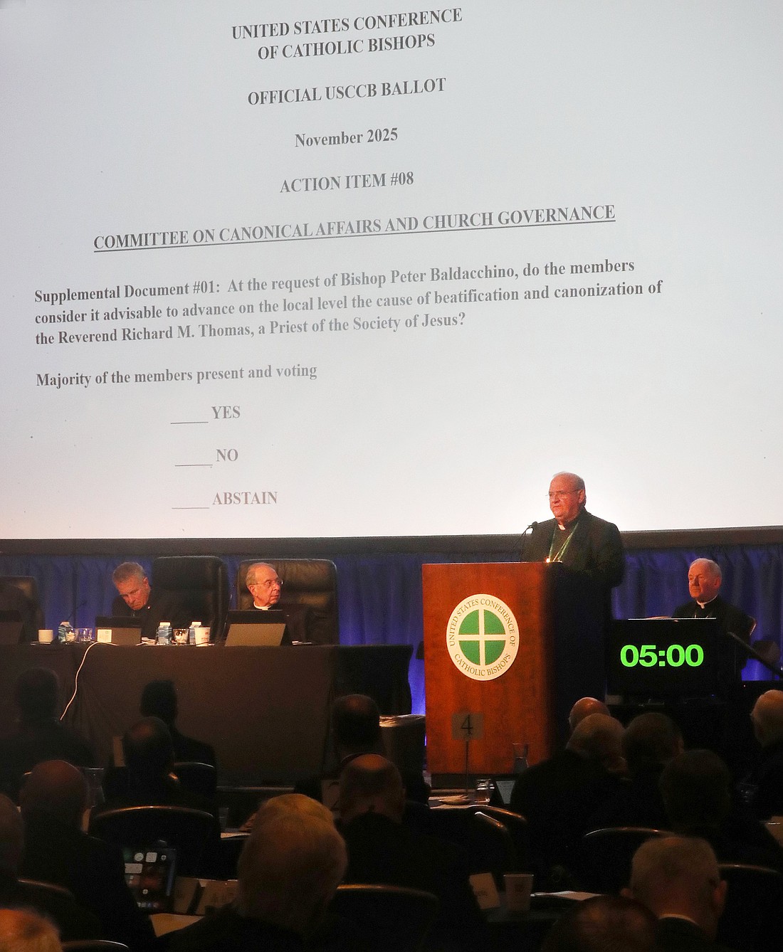 Bishop Peter Baldacchino of Las Cruces, N.M., speaks during a Nov. 11, 2025, session of the fall general assembly of the U.S. Conference of Catholic Bishops in Baltimore. Bishop Baldacchino and Bishop Thomas J. Paprocki of Springfield, Ill., spoke about a document to consider the advancement on the local level the sainthood cause of Jesuit Father Richard Thomas. (OSV News photo/Bob Roller)