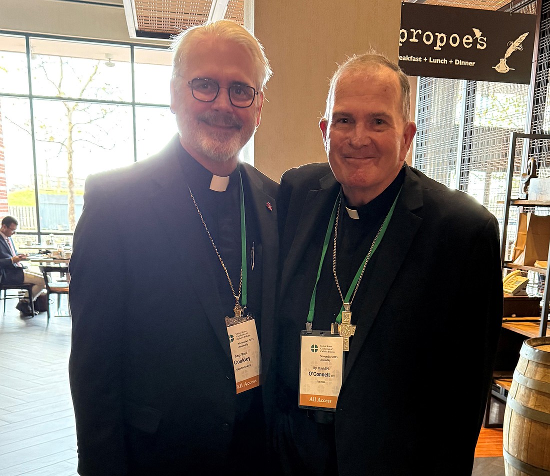 Bishop O'Connell greets Archbishop Coakley, the newly appointed president of the USCCB. Staff photo