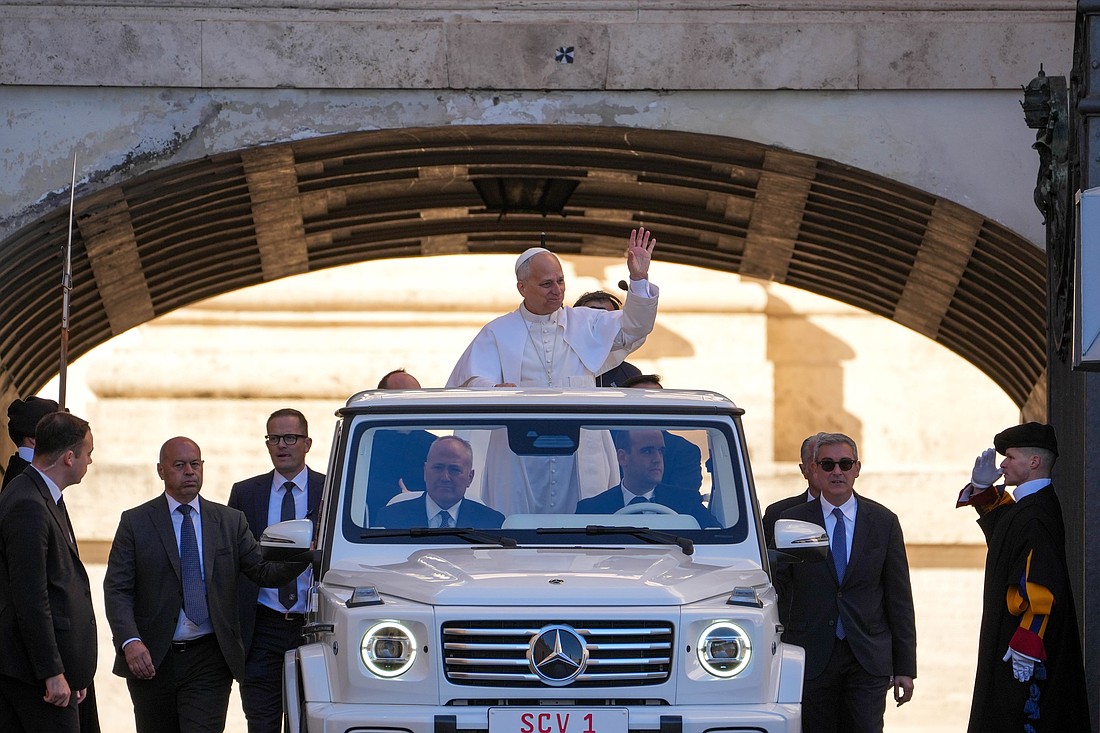 Pope Leo XIV greets visitors and pilgrims from the popemobile as he rides around St. Peter's Square at the Vatican before his weekly general audience Nov. 5, 2025. (CNS photo/Lola Gomez)
