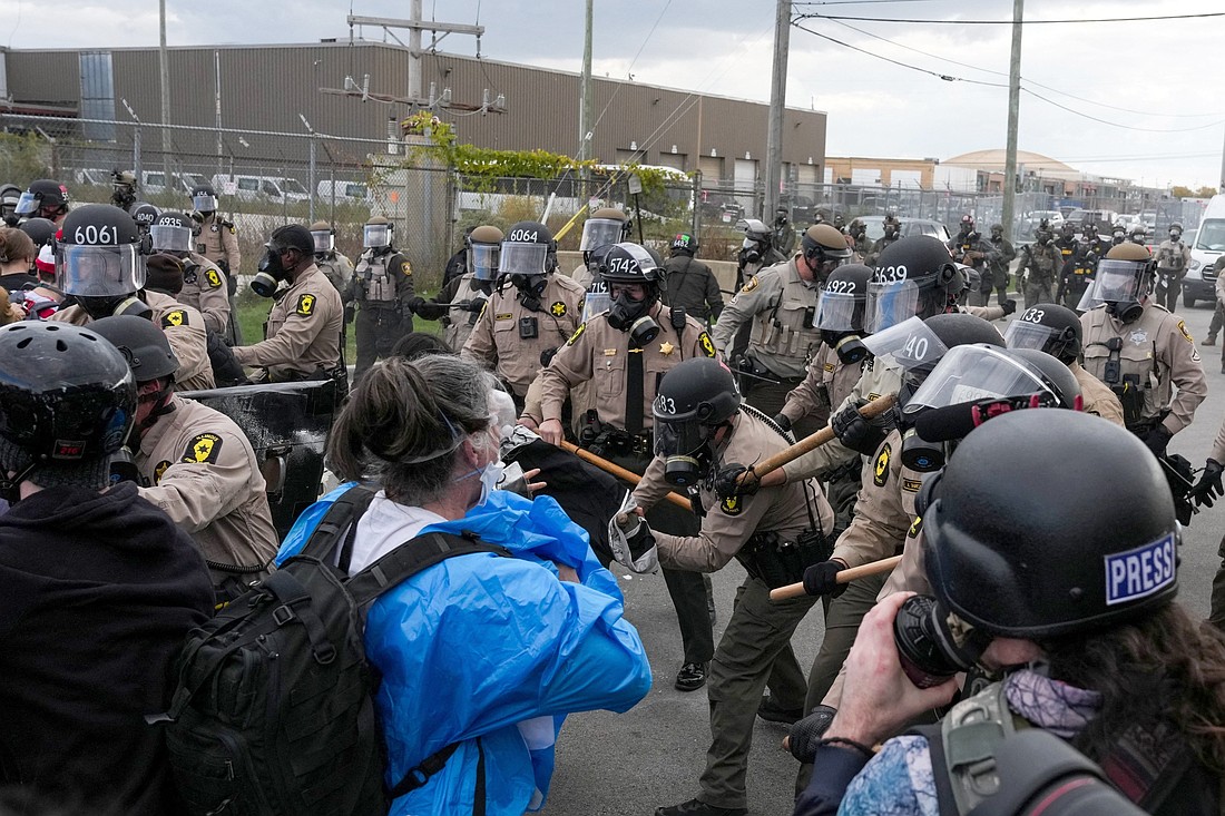 Law enforcement officers scuffle with demonstrators during a protest near the Broadview ICE facility in Chicago Nov. 1, 2025, after U.S. President Donald Trump ordered an increased federal law enforcement presence to assist in crime prevention. (OSV News photo/Leah Millis, Reuters)