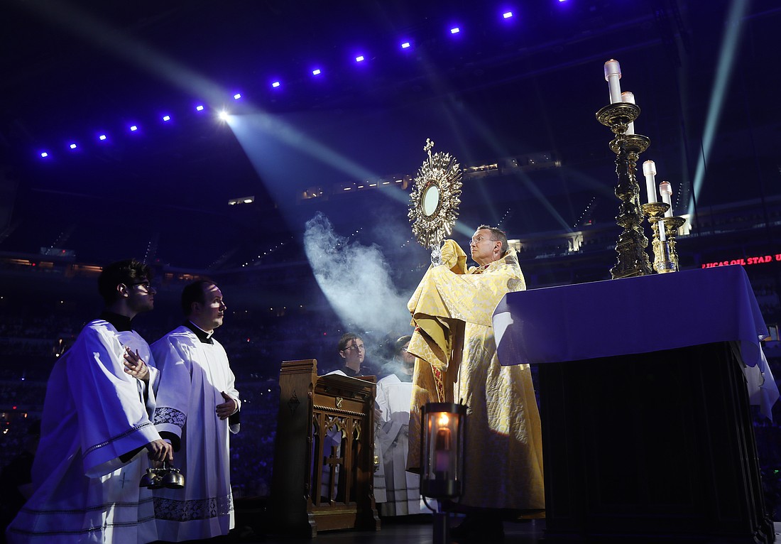 Bishop Andrew H. Cozzens of Crookston, Minn., chairman of the board of the National Eucharistic Congress Inc., blesses pilgrims July 17, 2024, during adoration at the opening revival night of the 10th National Eucharistic Congress at Lucas Oil Stadium in Indianapolis. (OSV News photo/Bob Roller)