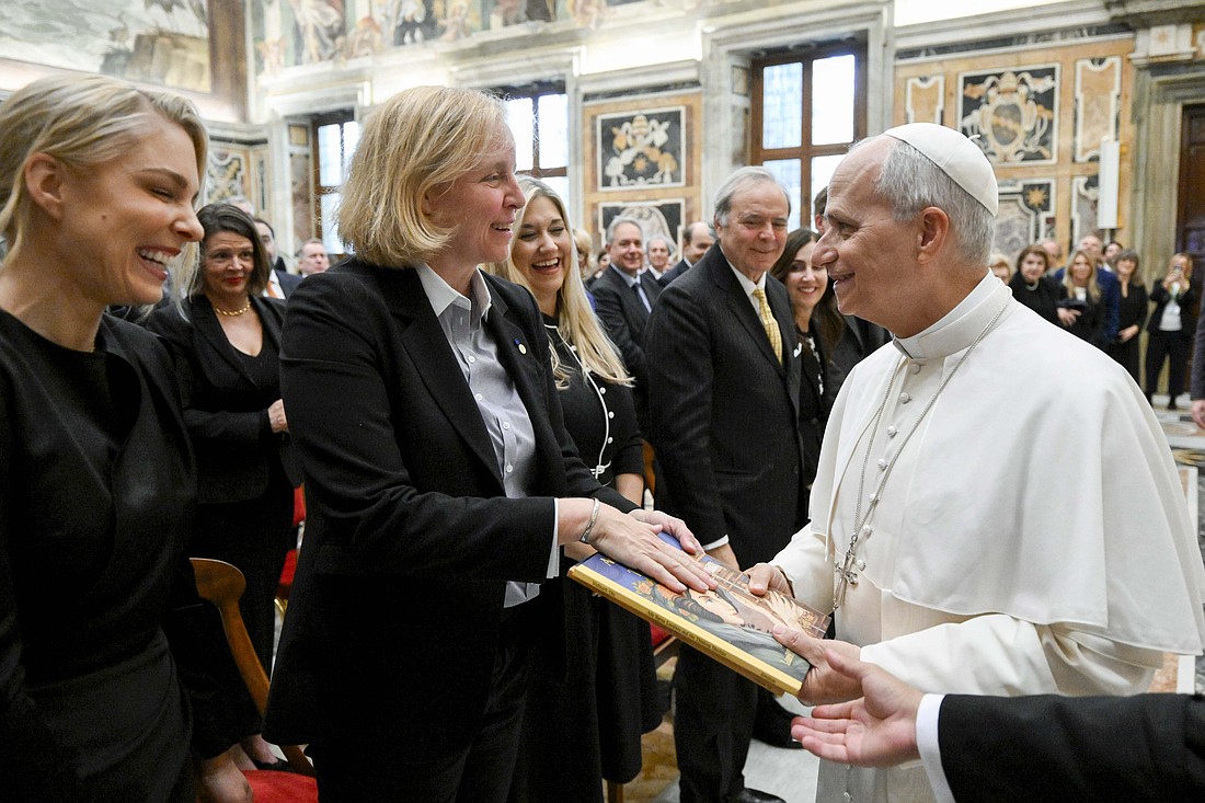 Pope Leo XIV receives children's books about women in science, including "Ada Byron Lovelace and the Thinking Machine," during an audience with participants in a conference, "The Dignity of Children and Adolescents in the Age of Artificial Intelligence," in the Apostolic Palace at the Vatican Nov. 13, 2025. (CNS photo/Vatican Media)