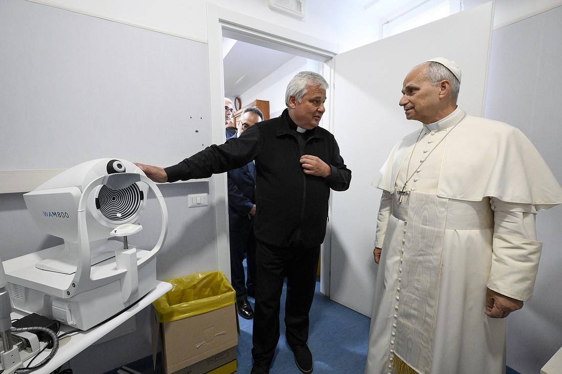 Cardinal Konrad Krajewski, prefect of the Dicastery for the Service of Charity, shows Pope Leo XIV a piece of equipment in the new St. Martin Clinic for the poor near the colonnade surrounding St. Peter's Square at the Vatican Nov. 14, 2025. (CNS photo/Vatican Media)