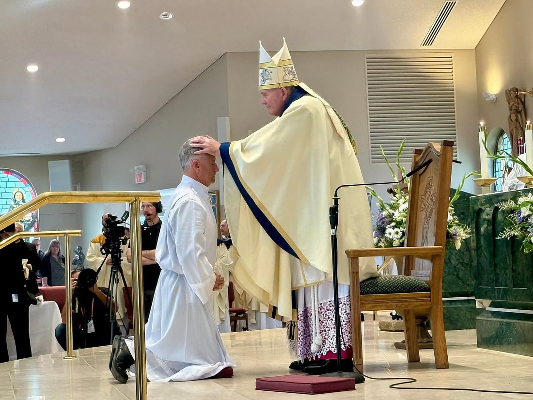 Bishop O'Connell imposes hands on the head of Jeffrey B. Miceli, ordaining him a deacon. Miceli serves in Our Lady of Good Counsel Parish, Moorestown. Rose O'Connor photo