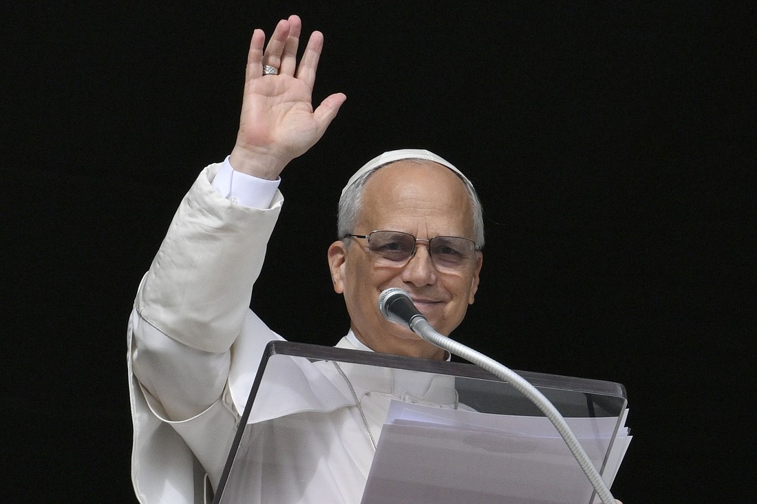Pope Leo XIV waves to an estimated 40,000 people in St. Peter's Square at the Vatican as he leads the recitation of the Angelus prayer Nov. 16, 2025. (CNS photo/Vatican Media)