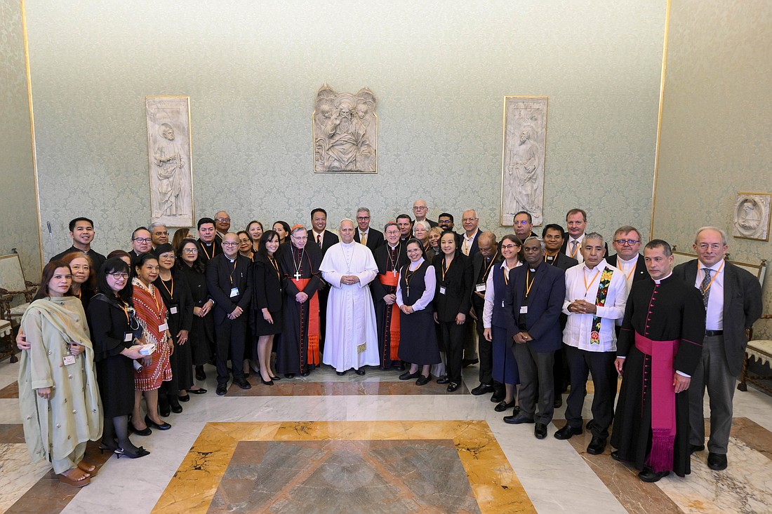 Pope Leo XIV poses for a photo with members of the Catholic Biblical Federation at the Vatican Nov. 17, 2025. (CNS photo/Vatican Media)