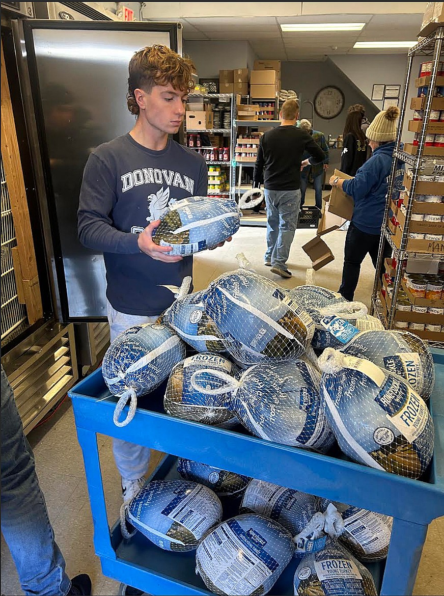 Students from Donovan Catholic High School, Toms River, volunteer Nov. 6 at the Seeds of Service food pantry in Brick. Courtesy photo