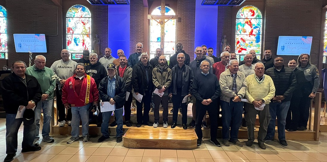 Gathered in the sanctuary of St. Benedict Church are the more than 30 U.S. veterans in attendance at a Veterans Day gathering on Nov. 7. Courtesy photos