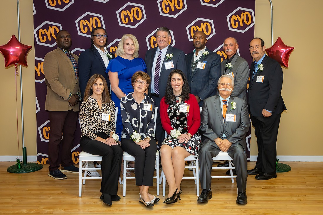 The 10th Mercer County CYO Basketball Hall of Fame Awards Dinner included 2025 inductees (front row, from left) Lisa Cesaro, Katie Casey, Nola Occhipinti Derita, Brian K. Sirak; (back row, from left)  Scharkner Michaud (representing IAABO 193), Khaliq Lewis (representing his dad, Khaliq Lewis), Dorothy Mayer Scranton, Tom Keefe, Cornell Nelson, Mike Novembre (representing IAABO 193) and Olix V. Heredia Jr. Missing from the photo is Tim Kramer. The dinner was held Nov. 15 at the Nottingham Ballroom in Hamilton. Photo by Amanda Ruch