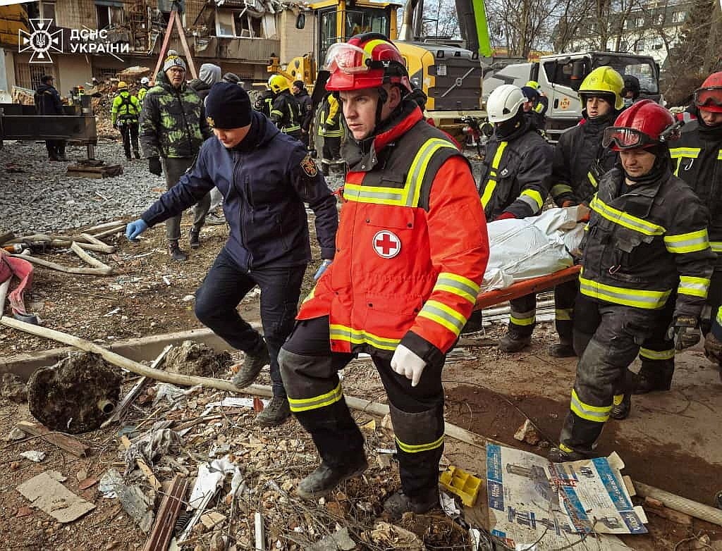 Rescuers carry the body of a person found under the debris of an apartment building  in Ternopil, Ukraine, Nov. 19, 2025, that was hit by a morning Russian missile strike amid Russia's ongoing war on Ukraine. (OSV News photo/Press service of the State Emergency Service of Ukraine via Reuters)..